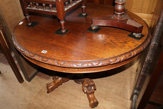 Circular carved oak extending dining table